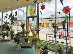 A wide range of colorful floral arrangements, awaiting their new home